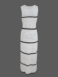 Detailed close-up of hollow crochet knit texture on a sleeveless striped maxi dress