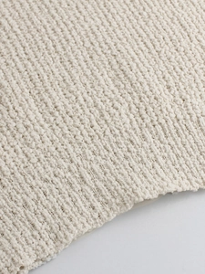 Jersey de punto con cuello en V y diseño calado en elegante color blanco crema suave
