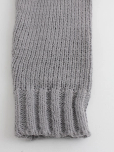 Gray chunky knit turtleneck sweater featuring classic vertical ribbing texture