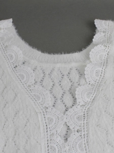White fuzzy knit sweater with delicate lace neckline embroidery and chic petal edges