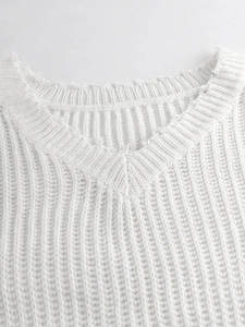 White V-neck knitted sweater with chunky rib texture and distressed collar detail