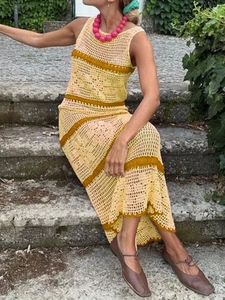 Detailed knit texture and hollow-out crochet pattern of the yellow striped sleeveless dress