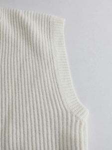 Detail shot of the ribbed knit armhole on this off-white V-neck vest cardigan