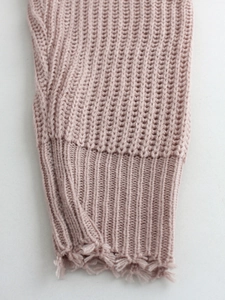 Pink knit sweater with V-neck, off-shoulder style and distressed ribbed cuffs
