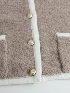 Knitted crewneck cardigan with fleece texture, contrast piping and gold crest buttons