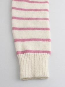 Women's knit pullover with pink and cream stripes featuring elastic ribbed cuffs