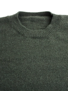 Women's dark green crew neck knit sweater with classic ribbed collar for autumn wear