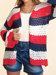 Close-up of the hollow openwork knit pattern on the colorful striped long sleeve cardigan