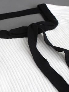 Women's white ribbed knit sweater with square neck and black contrast bow detail