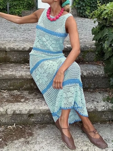 Detail of bohemian hollow knit maxi dress with light and dark blue striped texture