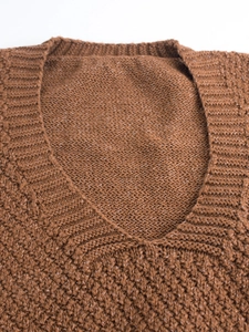 Chunky knit brown V-neck sweater vest with ribbed neckline and waffle texture detail