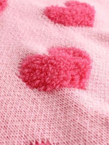 Women's crew neck sweater with pink knit fabric and 3D textured red heart patterns