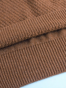 Caramel knitted V-neck vest featuring premium rib knit edges and textured fabric surface