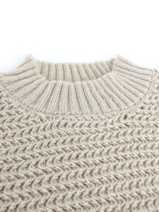 Women's beige round neck knit sweater with textured honeycomb pattern and ribbed neckline