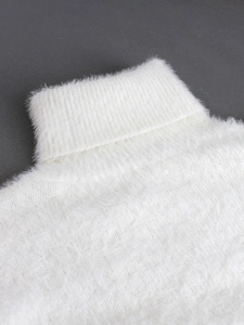 Chic white high-neck mohair sweater with plush texture and thick knit for winter warmth