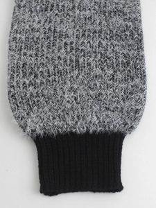 Knitted long sleeve sweater featuring gray mohair-like texture and black ribbed cuffs