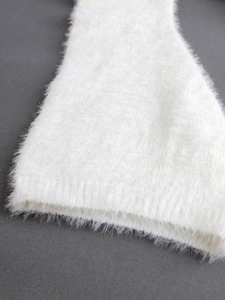 Women's white fuzzy knit sweater with long plush faux mink texture and ribbed cuffs