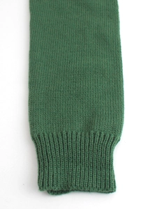 Deep forest green knit sweater with premium ribbed cuff detail and fine stitch texture