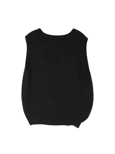 Detailed view of the ribbed edges and fine knit texture on a black v-neck sweater vest