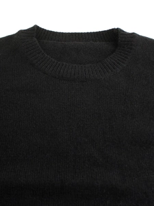 Close-up detail of the classic ribbed crew neck on a black knitted pullover sweater