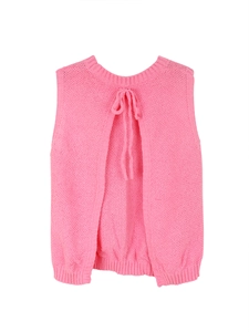 Detail of knitted backless vest showing deep split design and decorative pink ribbon tie