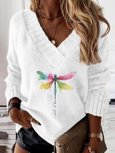 Detail of V-neck white knit sweater with colorful dragonfly print and let it be text