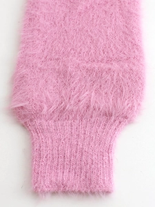 Close-up of pink faux fur knit cardigan sleeve showing soft texture and ribbed cuff detail