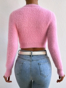 Pink mohair knit sweater with long sleeves and round neck shown from back view