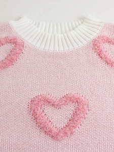 Pink knit sweater for women featuring 3D plush hearts and a classic crew neck collar