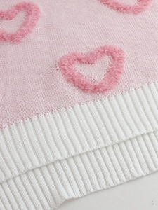 Pink knit sweater with 3D plush heart patterns and white ribbed hem for women