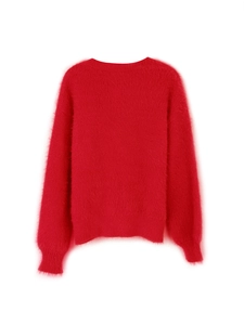 Detail of soft red knit cardigan showing plush texture and ribbed collar trim