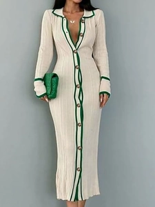Detailed view of knitted ribbed maxi dress with green contrast trim and button-down front