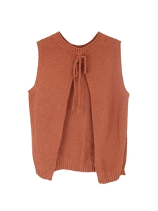 Detail of knit sleeveless top featuring back slit and adjustable self-tie ribbon design