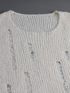 White crew neck knit sweater with distressed hole details and long sleeves for women