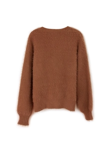 Macro detail of soft dark brown faux mohair knit sweater texture and plush long hair fabric