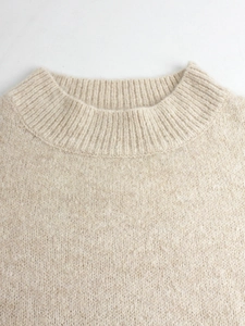 Elegant beige crewneck knit sweater for women with detailed ribbed collar texture
