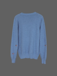 Light blue crewneck sweater with USA flag embroidery on the sleeve and knit texture