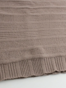 Women's light coffee knit crewneck sweater with ribbed hem and fine woven texture detail