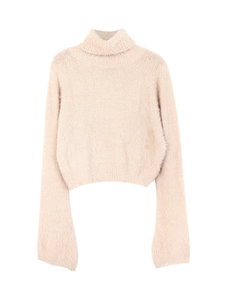 Detail shot of soft pale pink cropped turtleneck sweater featuring fluffy mohair texture
