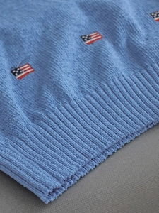 Blue crewneck knit sweater with American flag embroidery and ribbed hem detailing