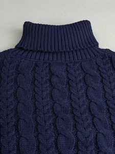 Women's high collar cable-knit sweater in navy blue with elegant ribbed texture details