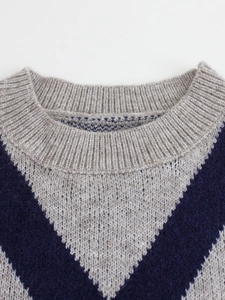 Women's knit sweater with contrast V-pattern, ribbed crew neck, and warm thick texture