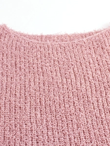 Close-up of soft pink ribbed knit sweater showing high-quality fuzzy texture and crewneck