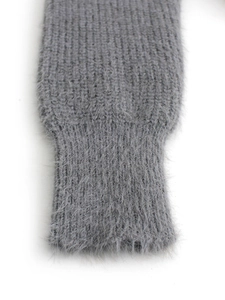 Detailed view of the ribbed cuffs on a grey long-sleeve knit sweater with soft fuzzy texture