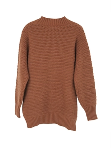 Close-up of brown knit sweater with detailed wavy herringbone pattern and ribbed collar