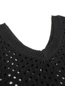 Knitted black V-neck dress featuring hollow mesh texture and ribbed neckline detail