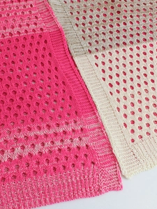 Knit short sleeve cardigan with honeycomb texture in pink and cream ribbed fabric