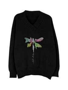 Detail of V-neck knit sweater featuring a colorful dragonfly print and 'let it be' text
