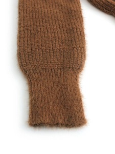 Detailed macro view of dark brown knitted ribbed cuffs with soft plush wool texture