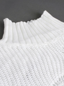 Close-up of white turtleneck knit sweater with hollow-out texture and ribbed collar